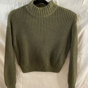 Olive green knit sweater.
